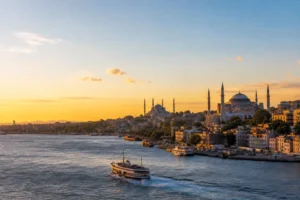 Istanbul skyline, Bosphorus ferries and historic domes at sunset