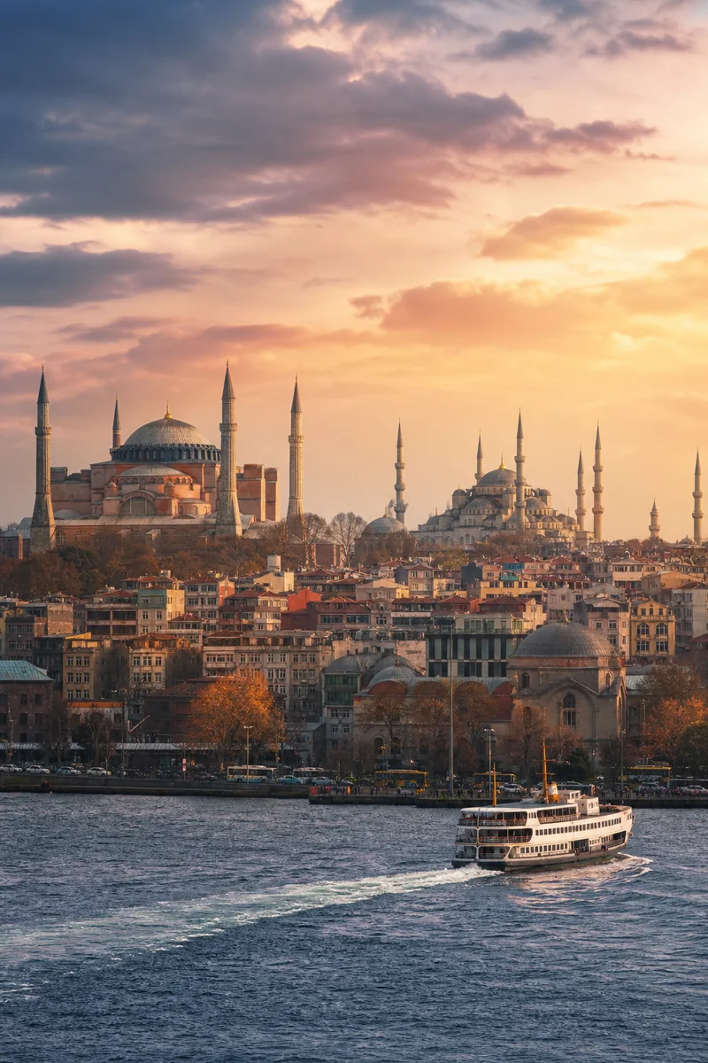 Istanbul skyline, Bosphorus ferries and historic domes at sunset