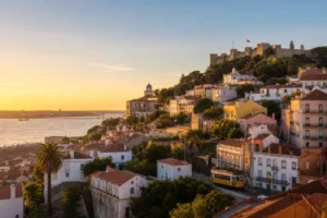 Lisbon hillside, tiled buildings and the Tagus River at golden hour