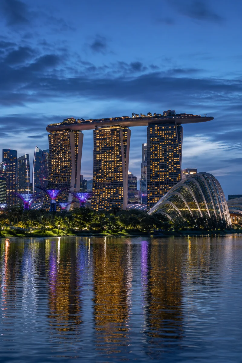 Singapore skyline with Marina Bay and Gardens by the Bay at blue hour