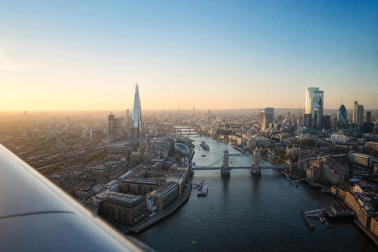 Aerial view of Tower Bridge, the River Thames and the London skyline at sunrise